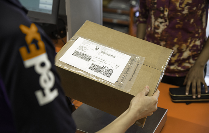 FedEx Courier holding a package FedEx Courier holding a package