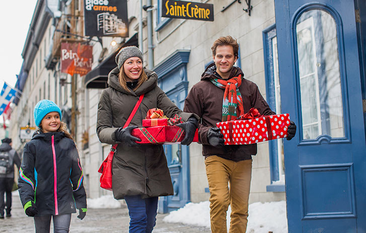 Family walking with holiday packages