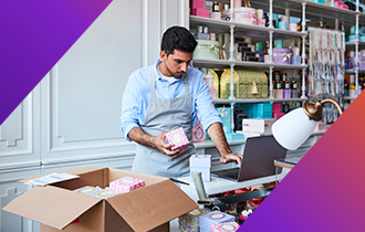 small business owner packing a FedEx box