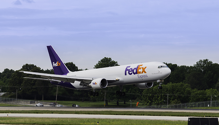 FedEx plane taking off from a runway