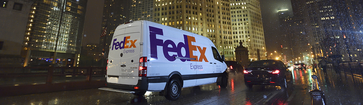 FedEx van in US street at night