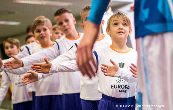 Player Mascots giving high-fives