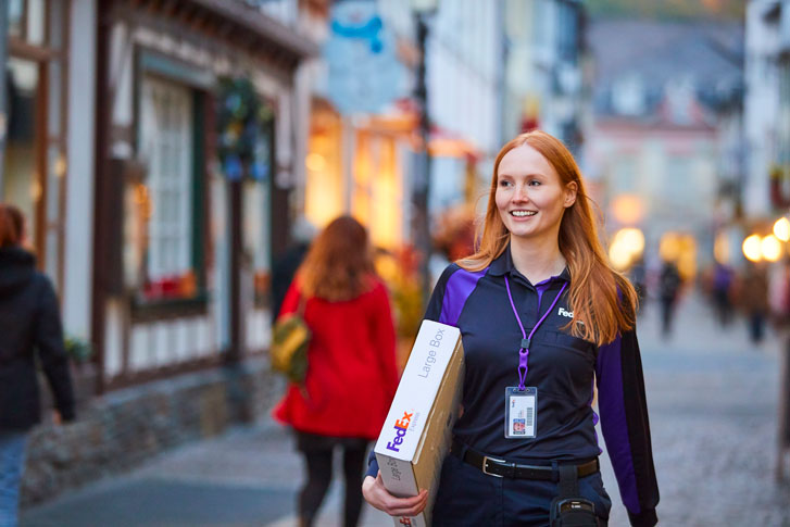 FedEx courier with package