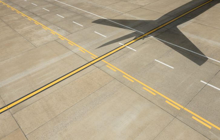 Airplane shadow on runway