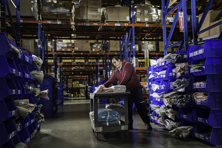 Shipping across borders Man behind desk is ready to ship