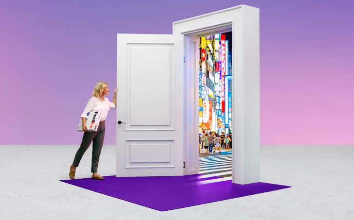 Person at an open door to Japan with a FedEx box