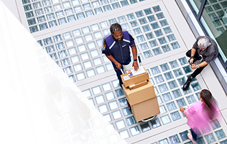 FedEx Courier walking down with FedEx boxes