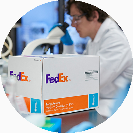 FedEx temperature conrolled package sitting in front on microscope