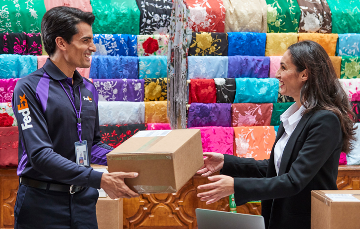 courier with shop keeper in fabric store