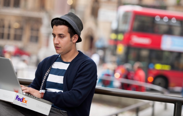 Man sitting in city
