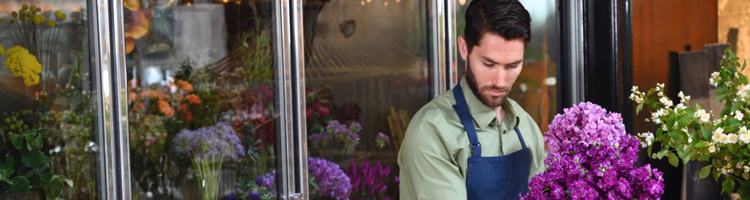 Business owner prepares flowers