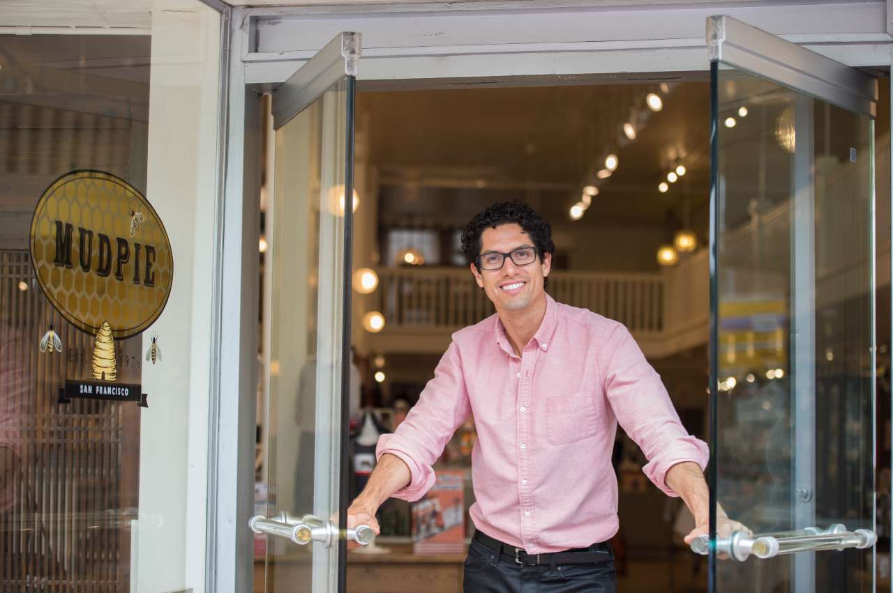 man standing in front of a business