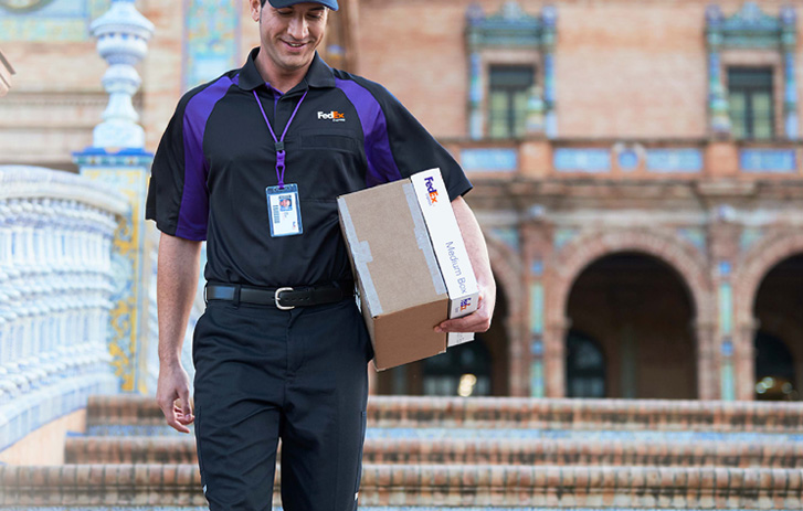 FedEx employee with package