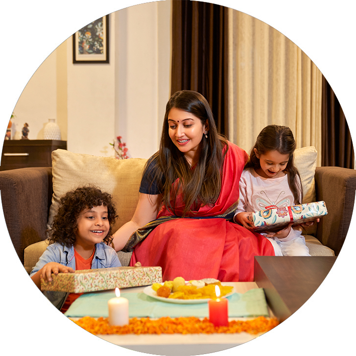 Woman with two children opening FedEx boxes with presents in them