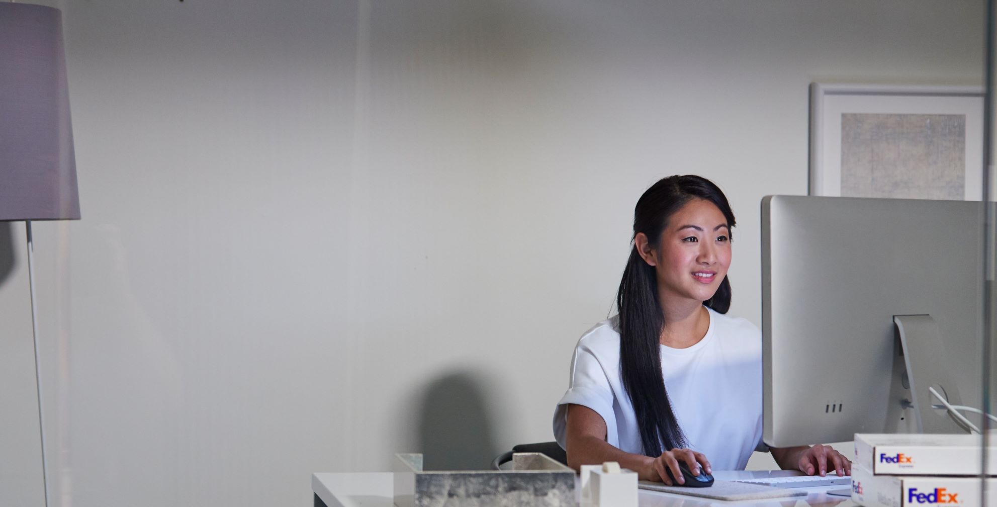 Young woman browsing her computer