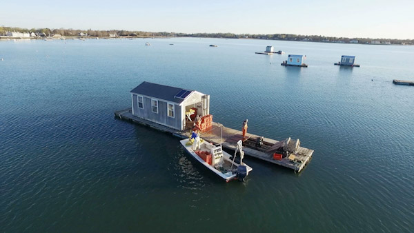 A boat and floating dock in Duxbury Bay