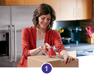 A woman taping a brown box for shipping