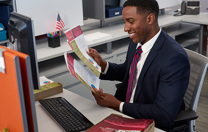 Man looking at goverment printed documents