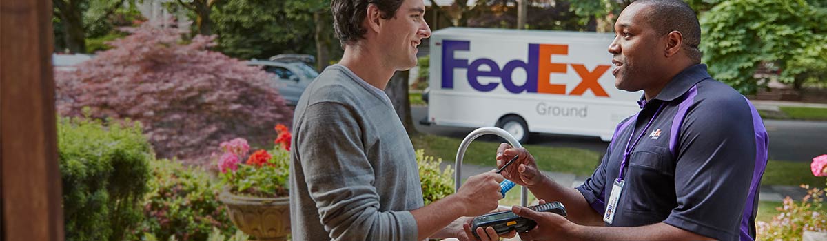 FedEx team member delivering a package to a customer.