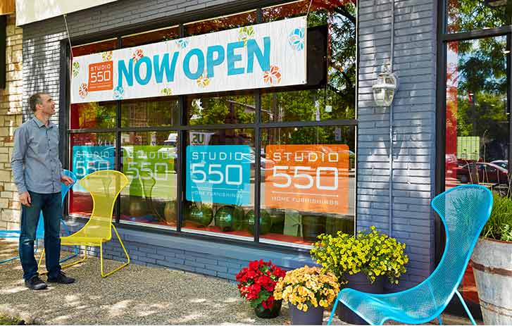 Man looking at outside banner