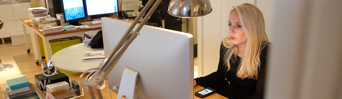 Customer on computer preparing a file for commercial printing