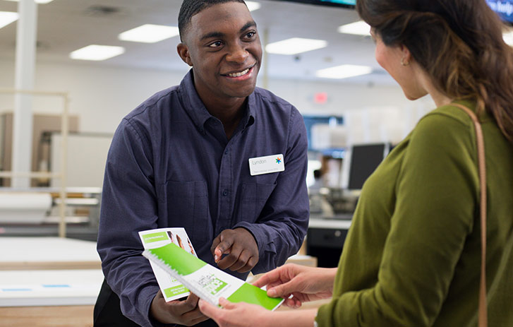 FedEx Office Employee helping Customer In-Store FedEx Office Employee helping Customer In-Store