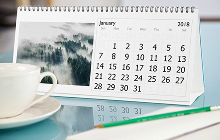 A gift calendar next to a mug