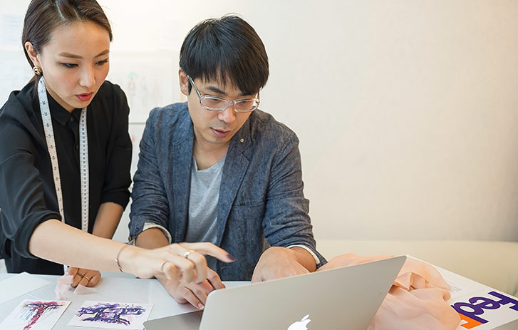 Customers using their mobile device to access online documents Customer using Google Drive on a laptop