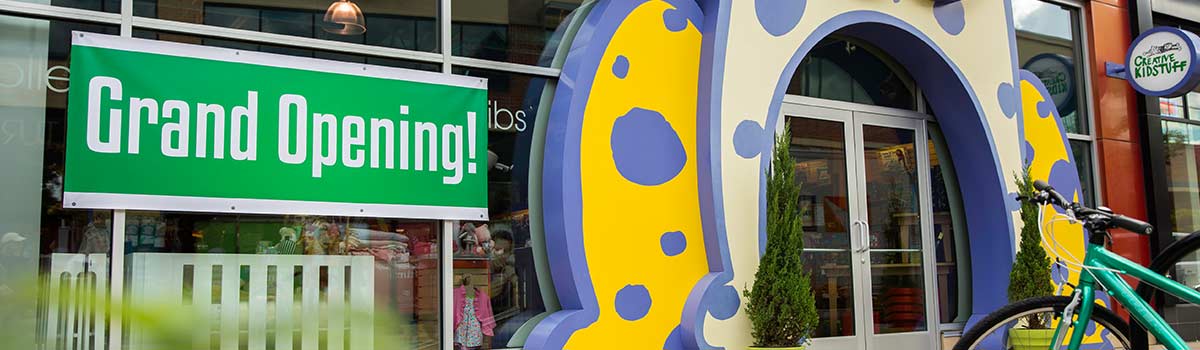 Grand opening banner on a store front