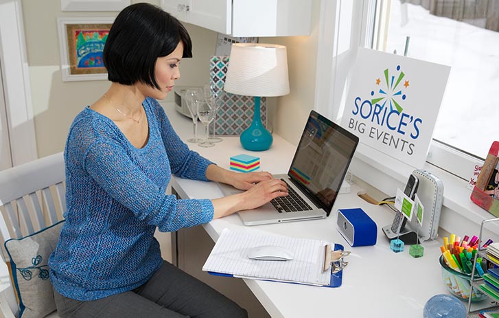 female designing on a laptop