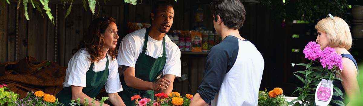 Small business owners selling at a nursery
