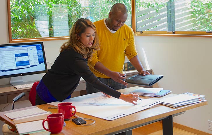 Online Marketing Services People in a home office working with marketing services