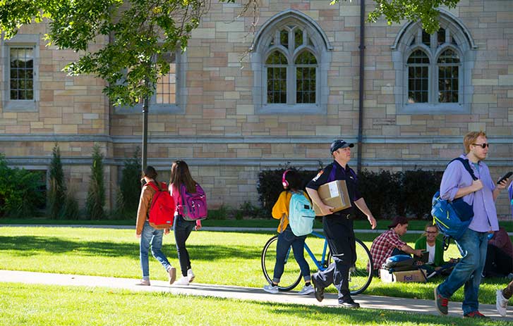 Higher Education Students walking on a campus