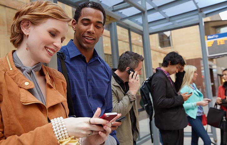 Woman and man looking at a cell phone