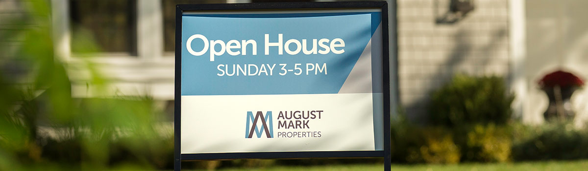 Open house sign in front of a house