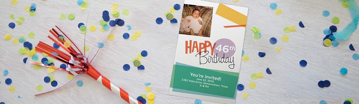 A photograph of a birthday party invitation on a table