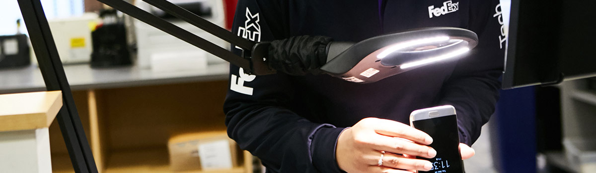 FedEx Samsung expert performing a phone repair.