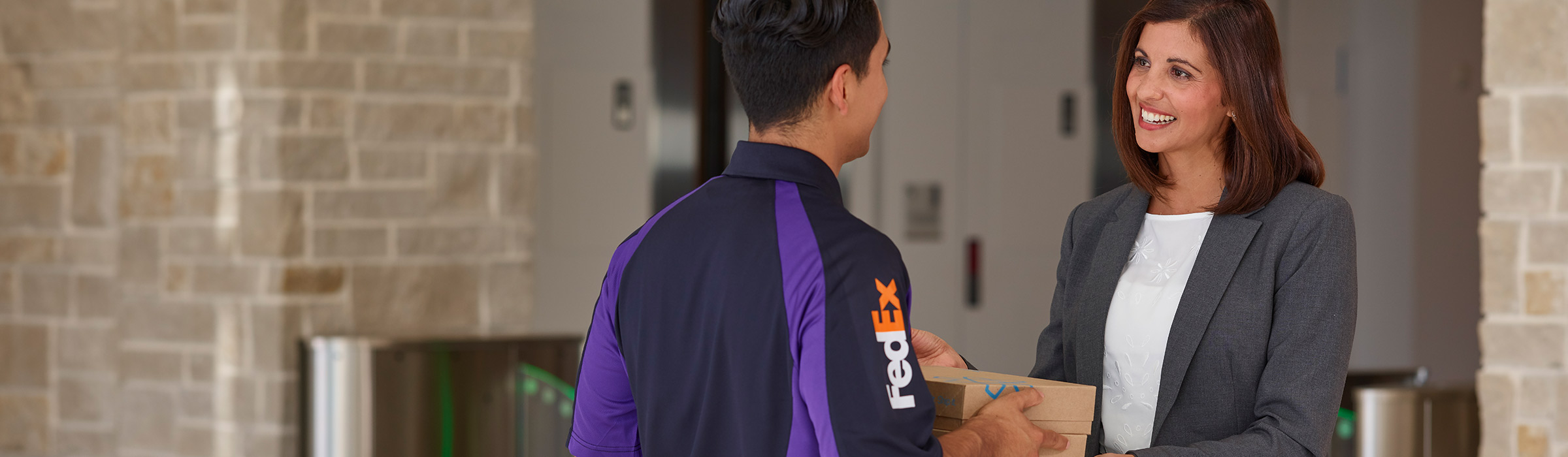 Business person receiving package from delivery driver