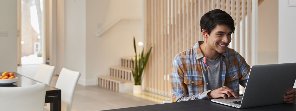 man on laptop at table