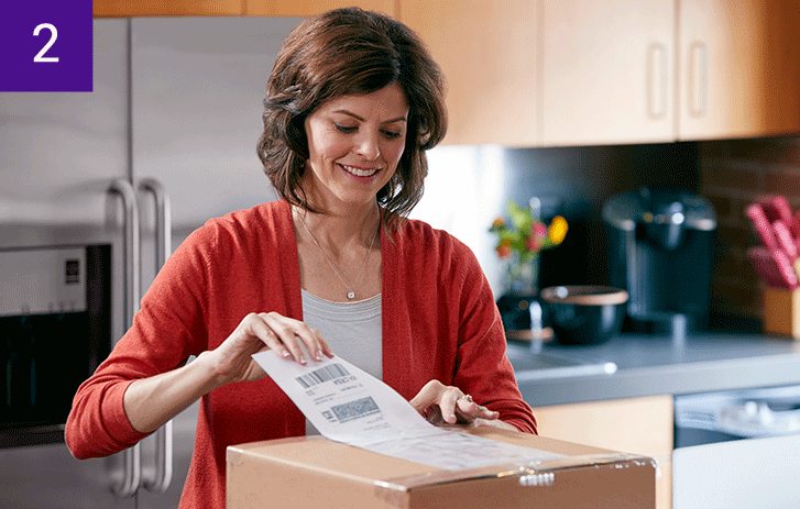 Customer affixing a shipping label