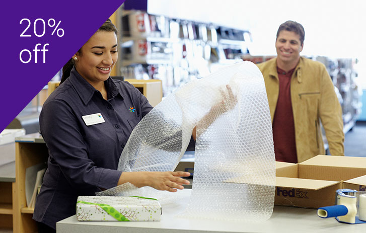 A helpful FedEx packing expert at work.
