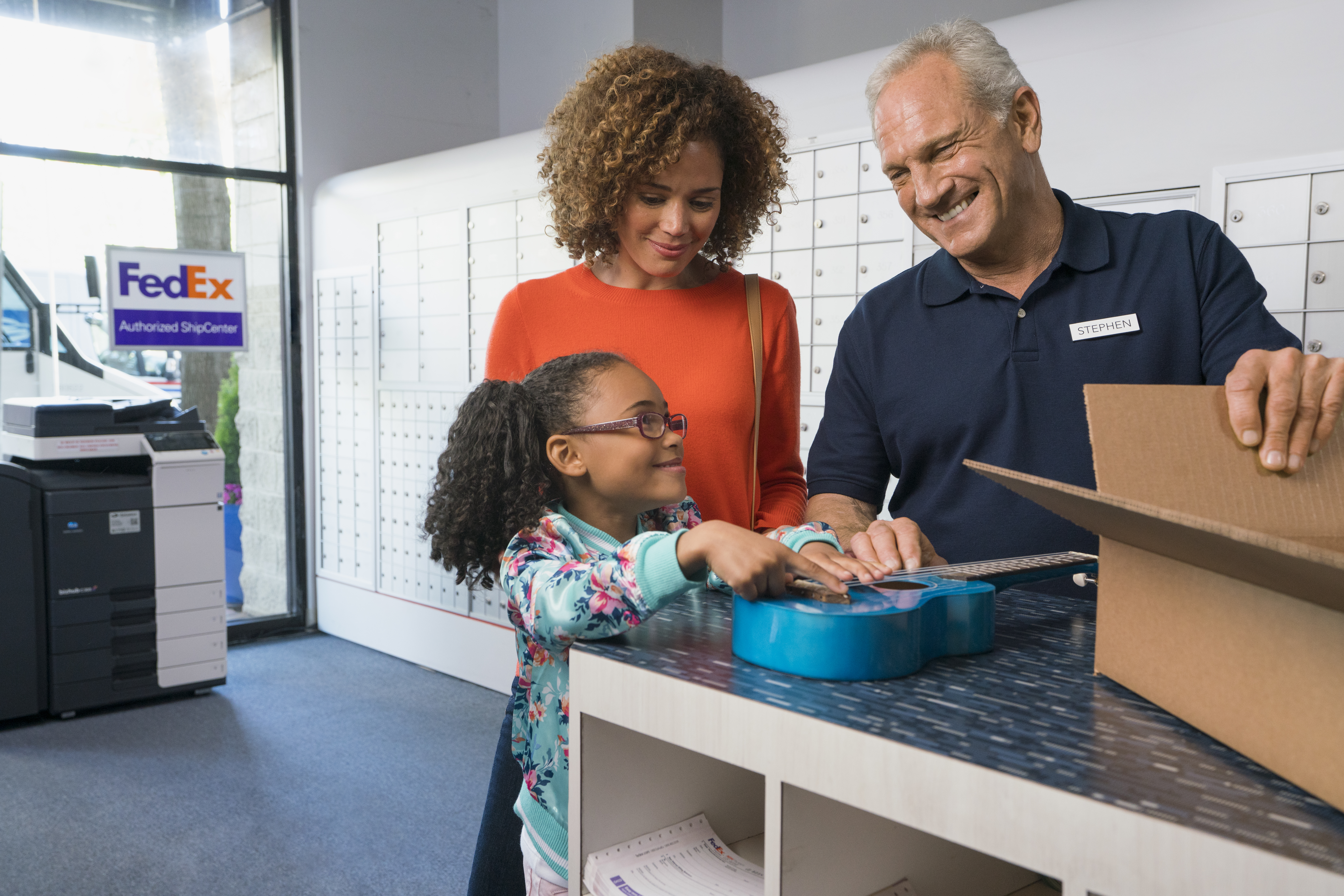 A FASC worker helping a family pack