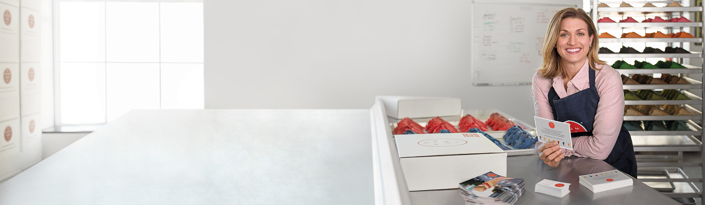 A small business owner with print products