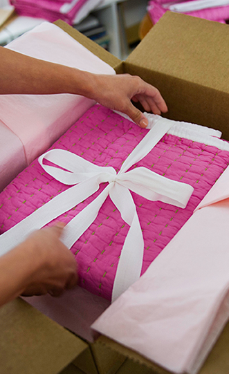 Customer placing a gift in a package