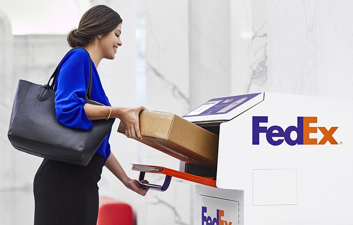 woman dropping off package at drop box