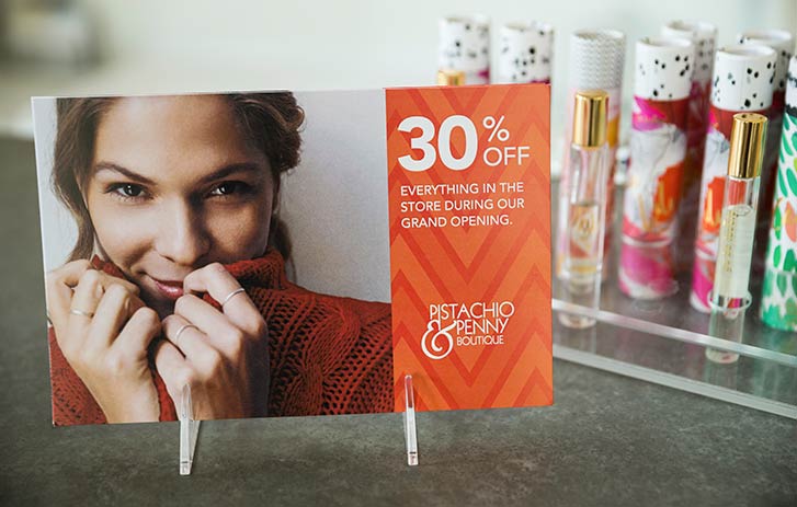 In-store discounts postcard A postcard display showing in-store discounts