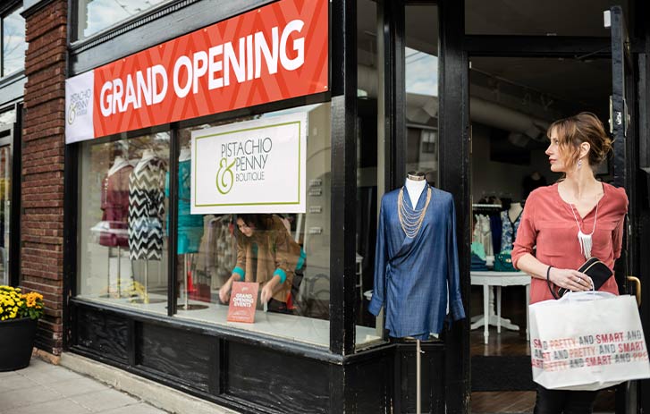 Grand opening banner outside a boutique Grand opening banner outside a boutique