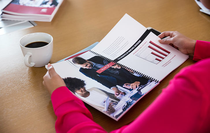 Business person looking through presentation Business person looking through presentation