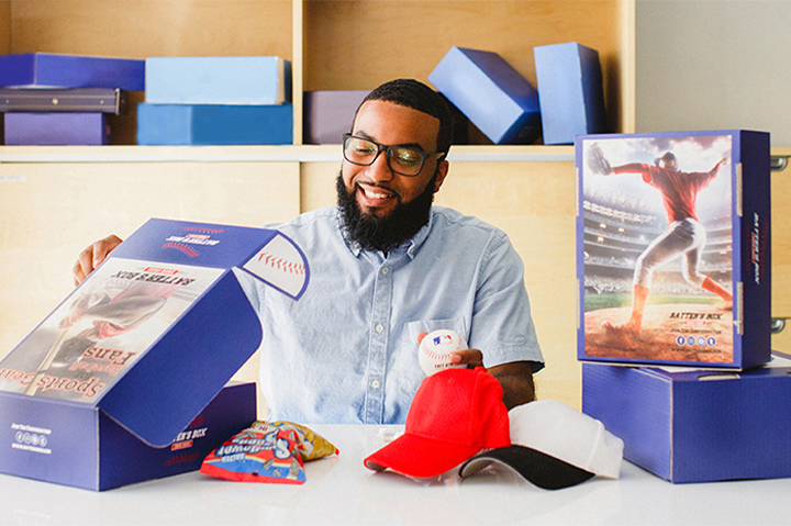 business owner with custom branded boxes