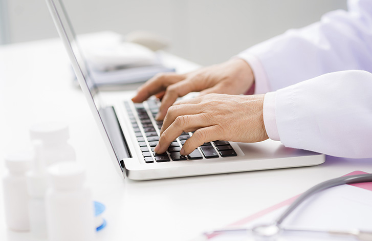 Person typing on a laptop